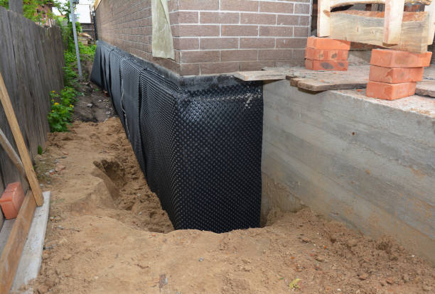Happy homeowners after waterproofing job in Beaverton